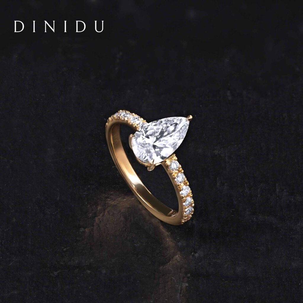 Pear Shaped Diamond and Round Brilliant Diamond Yellow Gold Ring - DINIDU